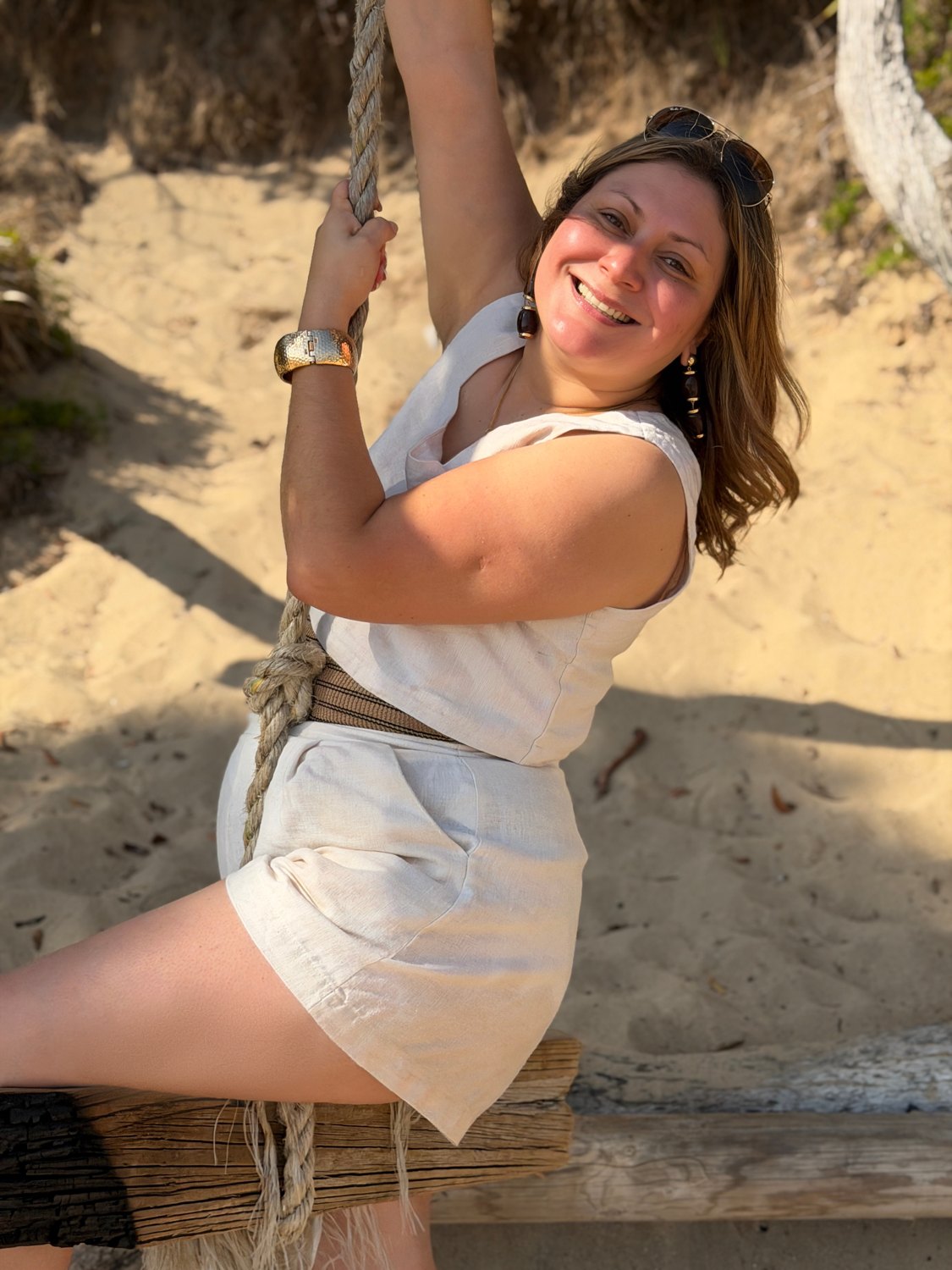 Jessica on a rope swing at the beach